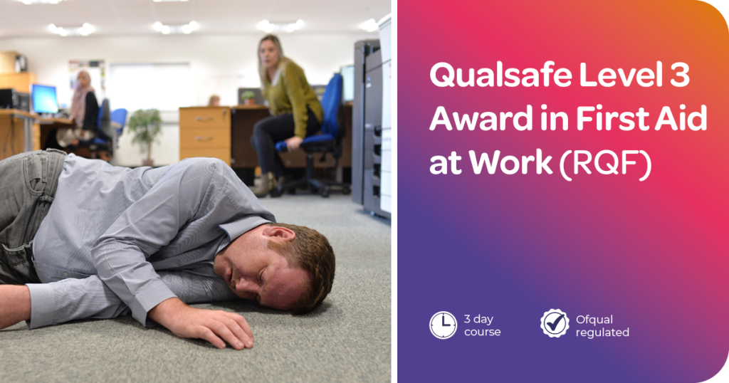 An unresponsive man in an office setting lying in the recovery position with a colleague assisting. Text: Qualsafe Level 3 Award in First Aid at Work (RQF) 3-day course.